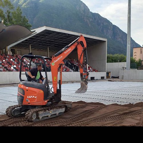 A natural grass surface for a sports facility during aeration and scarification